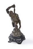 A bronze figure of a great ape with club