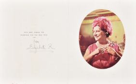 A pair of royal Christmas cards signed by Elizabeth the Queen Mother