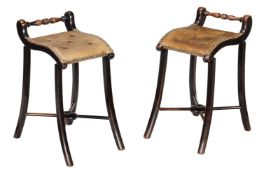 A pair of late Victorian ebonised Cellists' stools
