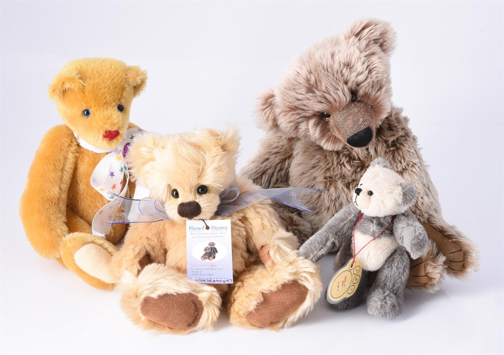 A GROUP OF FOUR TEDDY BEARS