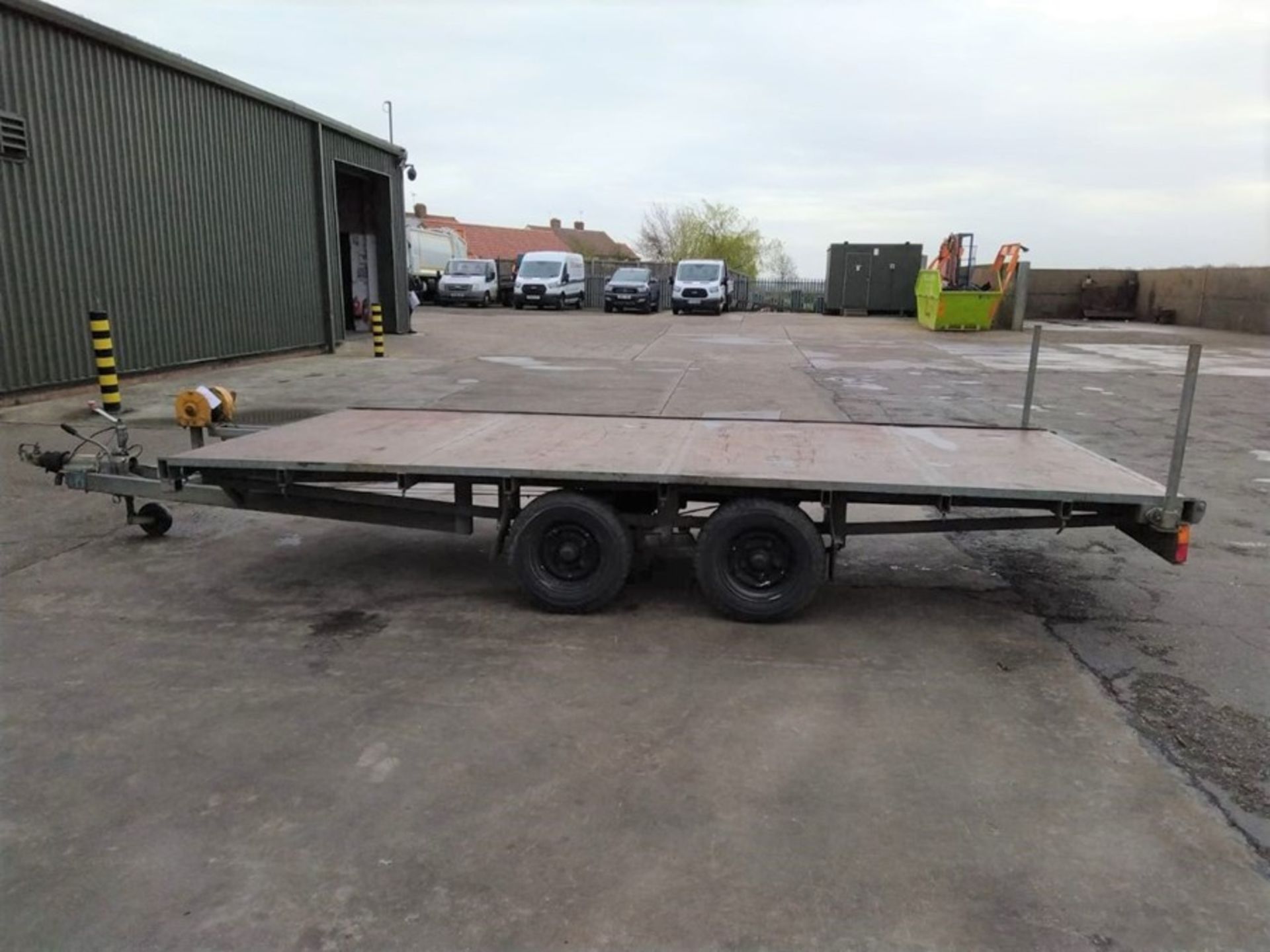 Double axle rough terrain 14 foot trailer with ramps and manual winch, very little used. RM Trailers