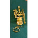 Large continental wall hanging brass bell with winged angel and cast Griffin design.