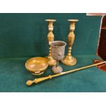 Pair of tall brass candlesticks, fire poker, mortar and pewter goblet.