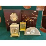 Wedgwood Interiors brushed steel mantle clock, 2 quartz carriage clocks and a booklet clock.