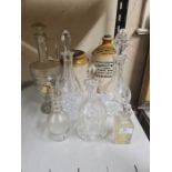 Various cutglass decanters and carafes with 2 stone jars.