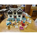 1970's wooden dolls house and accessories.