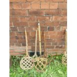 An assortment of 4 vintage wicker carpet beaters.