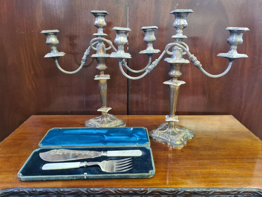 Large pair of worn EPNS candelabra and a pair of engraved EPNS mother of pearl handle fish servers