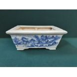18th century oriental blue and white porcelain planter with extensive staple repairs.
