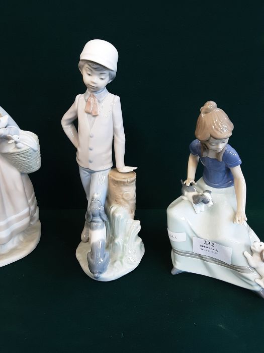 A pair of Lladro/Nao figurines Girl with puppies and Boy and his dog together with a Lladro figure - Image 3 of 4