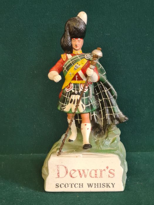 A counter top composition Dewar's White Label Scotch Whisky advertising figure.