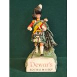 A counter top composition Dewar's White Label Scotch Whisky advertising figure.
