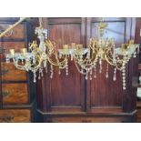Pair of modern gilt and crystal glass chandeliers.