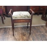 An Edwardian mahogany lift seat piano stool with boxwood string inlays and rosewood panel.