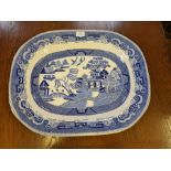 A large Victorian twig willow pattern meat dish, 54cm broad together with a later black and white