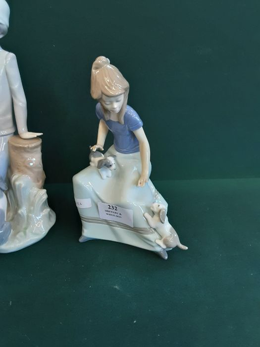 A pair of Lladro/Nao figurines Girl with puppies and Boy and his dog together with a Lladro figure - Image 2 of 4