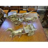 Large brass ornaments, a Hansome carriage and horse, horse and cart and an eagle. 8.4kg.