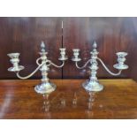A pair of silver plated short candlesticks with beaded decoration and detachable candelabra tops.