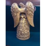 A large 45cm tall gilt resin, flute playing angel figure.