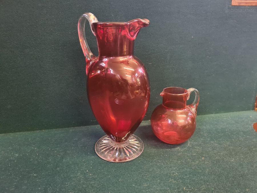 Large Victorian cranberry glass jug with clear cut foot standing 11" tall and a similar smaller - Image 5 of 5