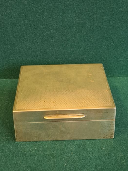 Silver engine turned table cigarette box, 85mm square, 35mm tall, London 1938.