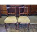 A pair of late Victorian bar back turned legged mahogany dining chairs.