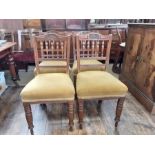 Set of 4 late Victorian oak stuff overseat dining chairs with carved top rail and turned front