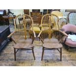 A pair of stick arm elm and ash Windsor chairs in need of some repairs,