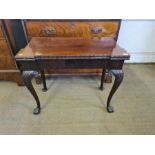 Georgian mahogany card table with outset corners, acanthus carved edging upon carved ball and claw