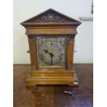 An oak cased Winterhalder & Hofmeier bracket clock with quarter chiming movement, brass dial with