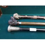 Silver topped gentlemans walking cane, resin hound head walking can and other walking sticks.