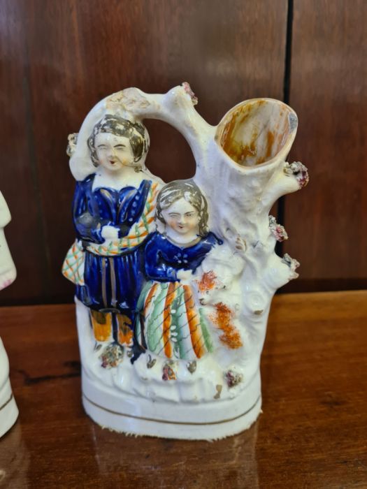 Staffordshire flat back figure, flower sellers and a spill vase of a Scottish couple. - Image 2 of 5