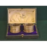 A pair of Broadway & Co engine turned napkin rings, Birmingham 1936 in associated Walker & Hall