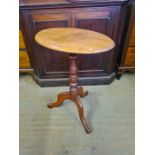 Victorian mahogany oval topped turned column tripod based occasional table.