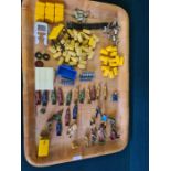 A mixed tray lot of toy parts to include Britains and Corgi hay bales, toy cab roofs, lead soldiers,