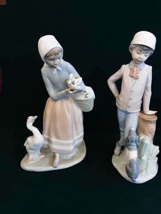 A pair of Lladro/Nao figurines Girl with puppies and Boy and his dog together with a Lladro figure - Image 4 of 4