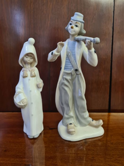 Lladro glazed figure of a young girl with a basket and a similar figure of a violin playing clown. - Image 2 of 6