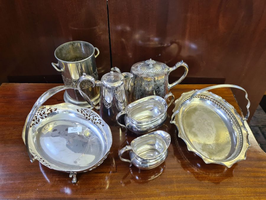 Assorted plated wares to include cake baskets, bottle holder, EPBM chased teapot, sugar and cream