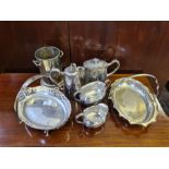 Assorted plated wares to include cake baskets, bottle holder, EPBM chased teapot, sugar and cream