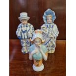 Pair of continental porcelain nodding figures and a German porcelain half doll.