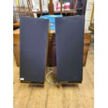 A pair of monitor audio system R352 speakers on stands (both stands present).