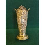 An Elkington & Co silver Monteith style silver vase with embossed winged cherubs and shell and