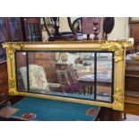 Regency gilt overmantle mirror with applied acanthus leaves and reeded glazing bars, 140cm x 62cm.