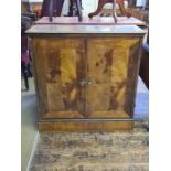 Continental walnut narrow 2 door cupboard with quartered veneered and crossbanded doors, top and