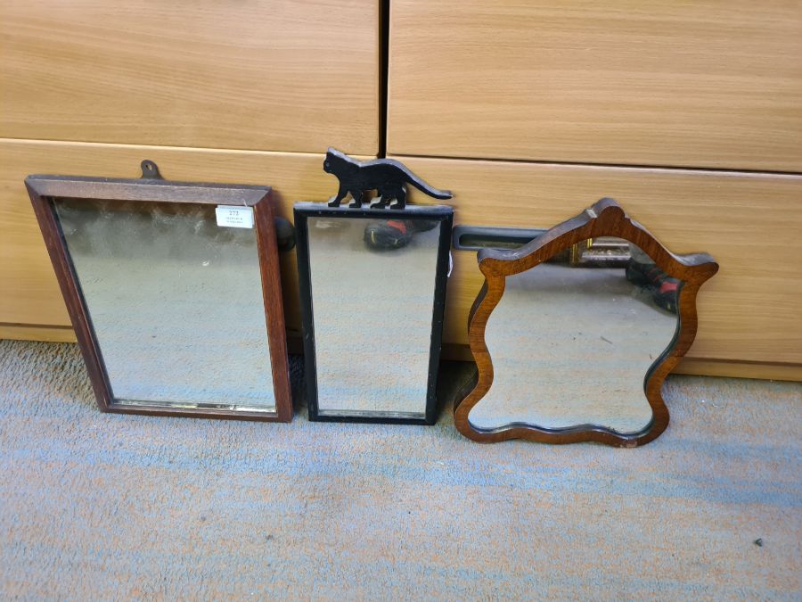 3 small wooden framed wall hanging mirrors.