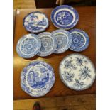 Assorted blue and white flatwares to include dishes, dessert plate, willow pattern plates and floral