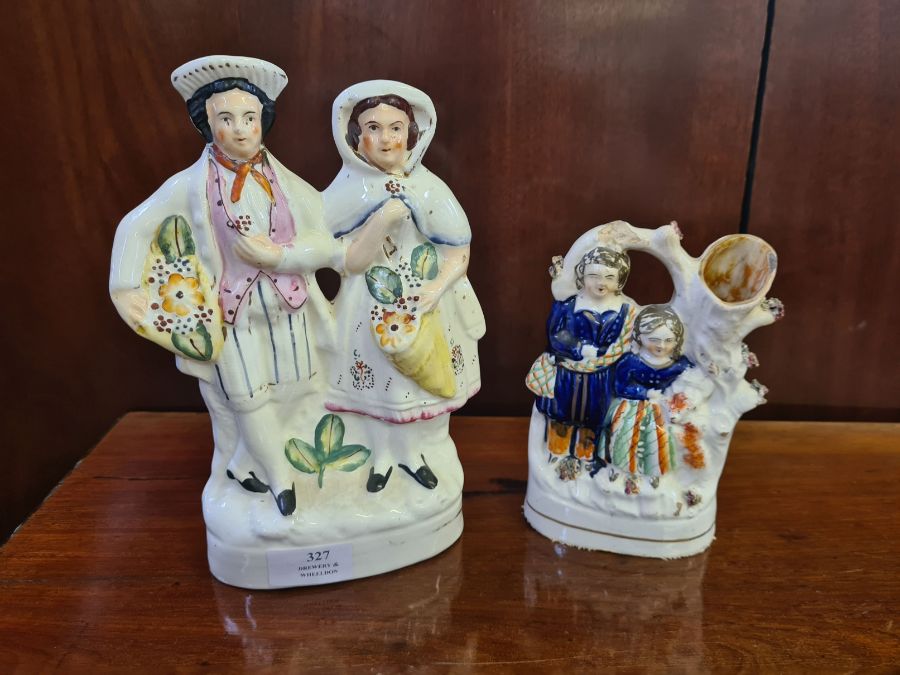 Staffordshire flat back figure, flower sellers and a spill vase of a Scottish couple.