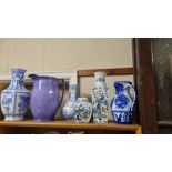 Collection of oriental style blue and white vases, ginger jar and a glazed earthenware jug.