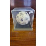 Scunthorpe United Football Club signed football in display case.