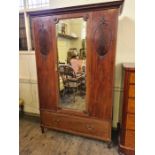Edwardian mahogany mirror door wardrobe with lower drawer decorated with carved roundels and oval